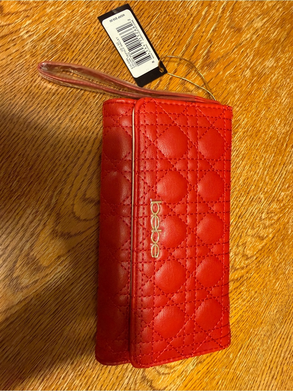 bebe Red Quilted Wristlet Phone Case with Gold Logo